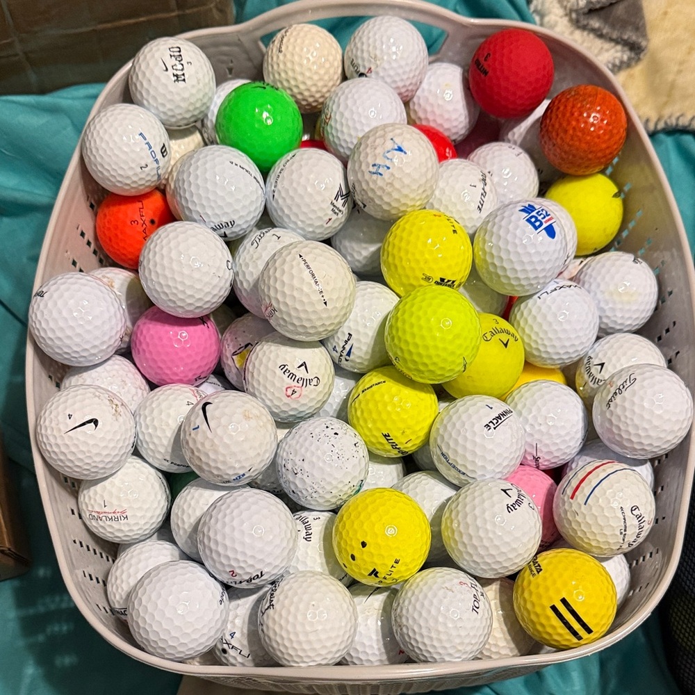 Dozen assorted golf balls